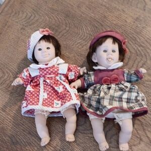 Adorable Twin Dolls in Red and Purple Dresses